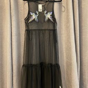 Bathing suit cover up or over top. Never worn